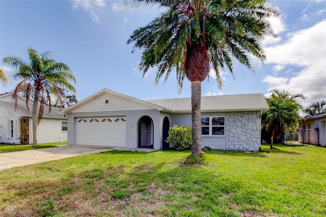 single story home featuring an attached garage, stucco siding, driveway, and a front yard