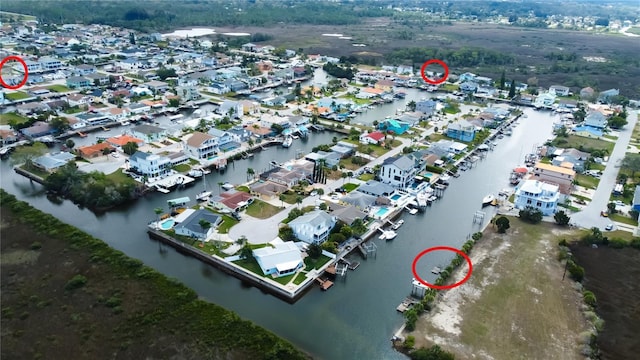 aerial view with a residential view and a water view