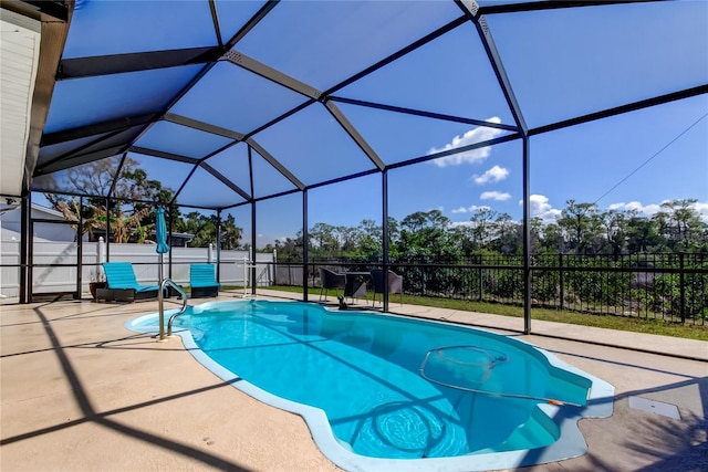 view of pool featuring a fenced in pool, glass enclosure, a patio area, and fence