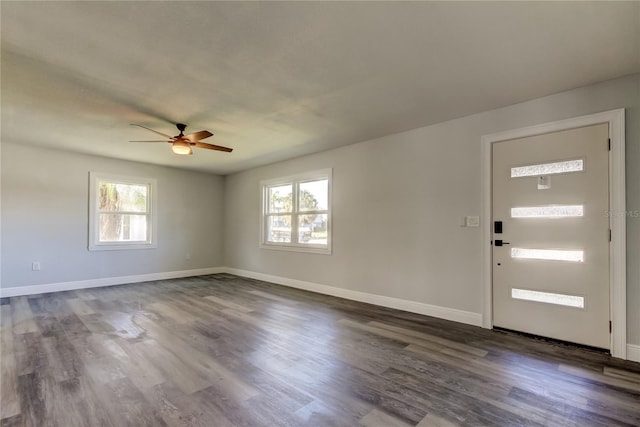 foyer with dark wood-style floors, baseboards, and a ceiling fan