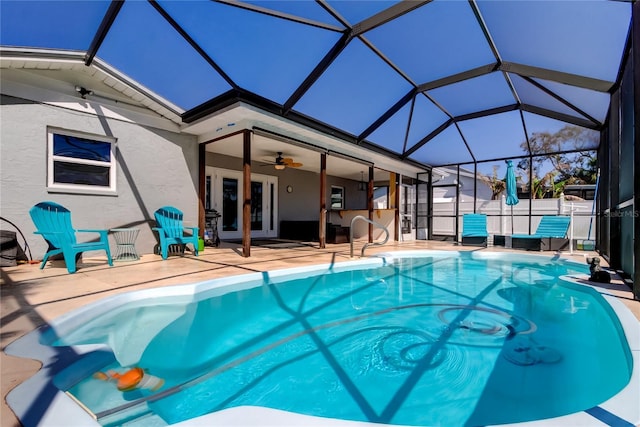 view of swimming pool featuring a fenced in pool, a ceiling fan, glass enclosure, french doors, and a patio area