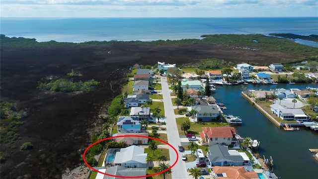 birds eye view of property featuring a residential view and a water view