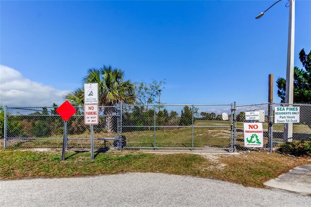 surrounding community featuring fence and a gate