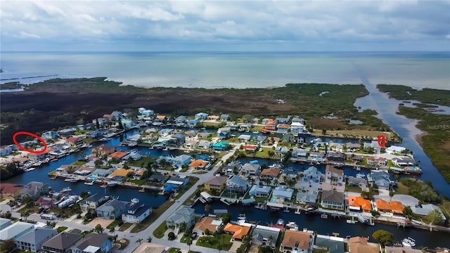 aerial view featuring a water view and a residential view