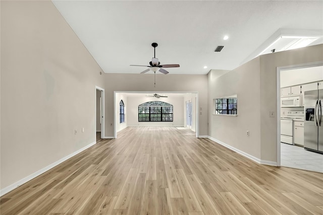 unfurnished living room with light wood-style flooring, visible vents, baseboards, and a ceiling fan