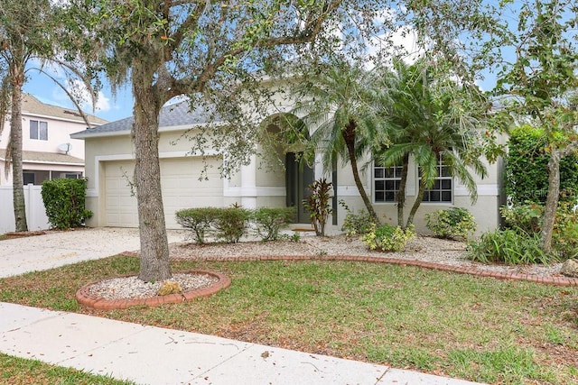 view of front facade with a garage and a front yard