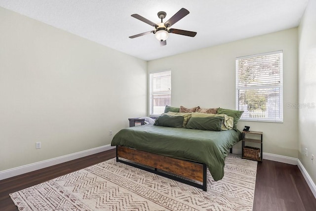 bedroom featuring hardwood / wood-style floors and ceiling fan