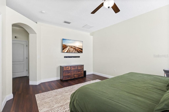 bedroom with dark hardwood / wood-style floors and ceiling fan