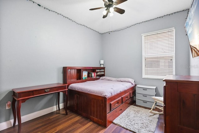 bedroom with ceiling fan and dark hardwood / wood-style flooring