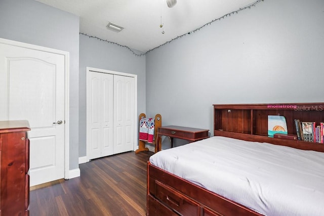 bedroom featuring dark wood-type flooring and a closet