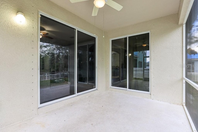 exterior space featuring ceiling fan