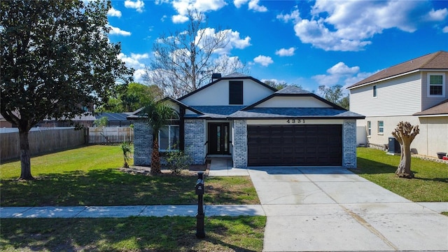 front of property with a garage and a front yard