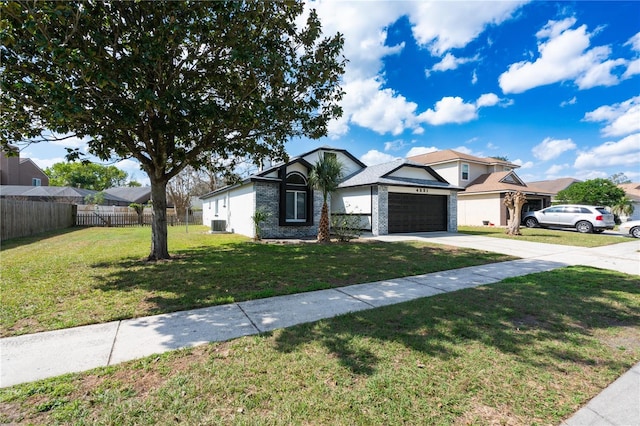 ranch-style home with a garage and a front lawn