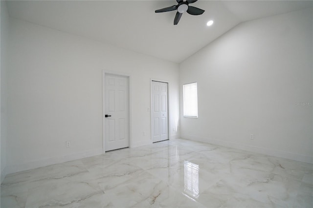 empty room featuring ceiling fan and high vaulted ceiling