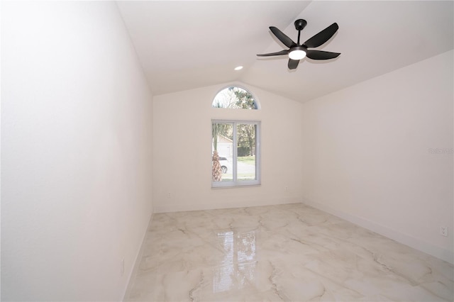 spare room featuring vaulted ceiling and ceiling fan