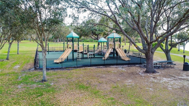 view of jungle gym with a lawn