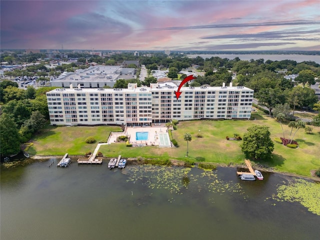 aerial view at dusk with a water view