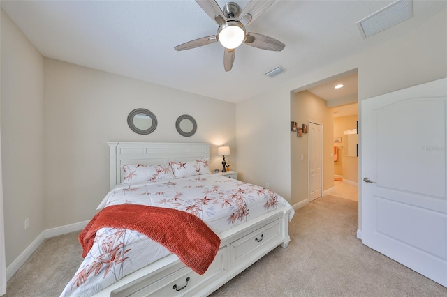 bedroom with light carpet and ceiling fan