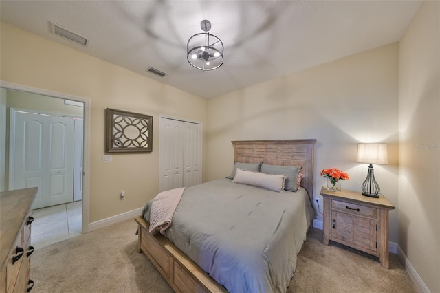 carpeted bedroom featuring a closet