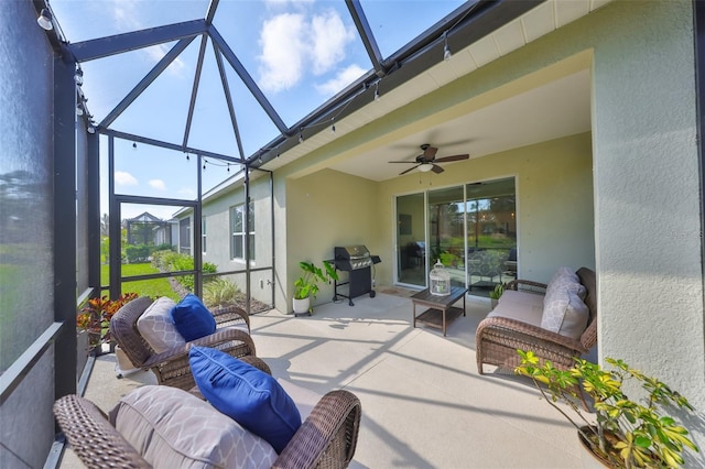 sunroom / solarium with ceiling fan and a skylight