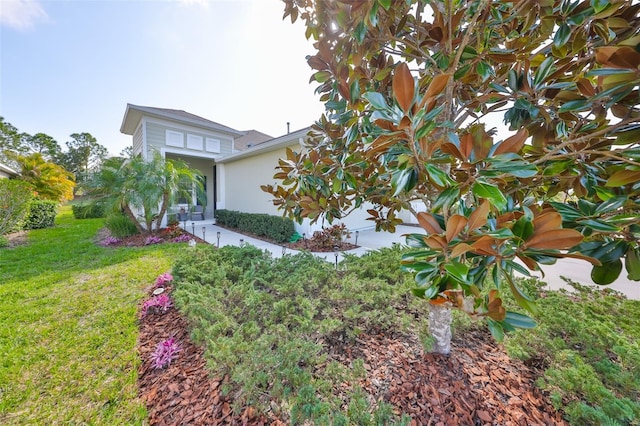 view of property exterior featuring a lawn