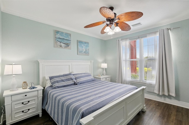 bedroom with ceiling fan, dark hardwood / wood-style flooring, and crown molding