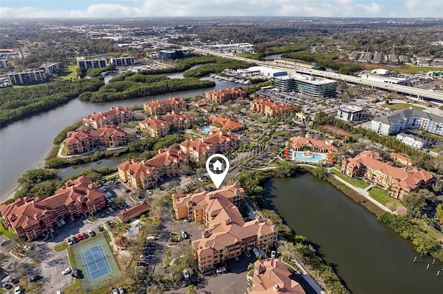 birds eye view of property with a water view