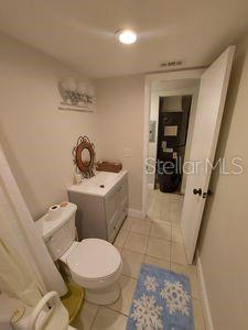 10033 64th Ave N Unit 9, Saint Petersburg, FL 33708 - bathroom featuring toilet and tile patterned floors