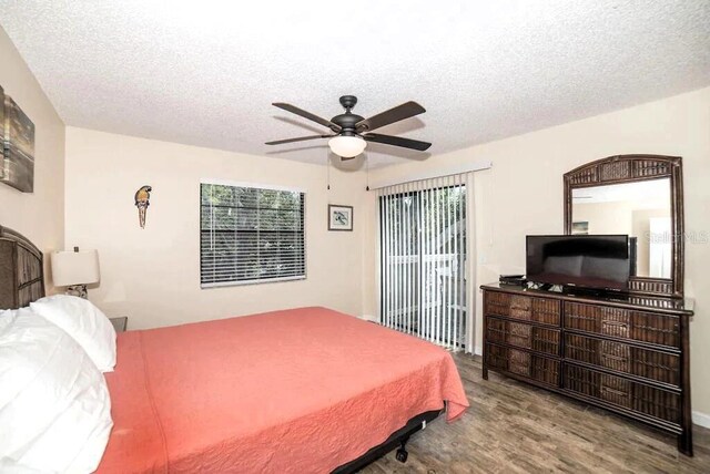725 1st St, Indian Rocks Beach, FL 33785 - bedroom with wood finished floors, a textured ceiling, and a ceiling fan