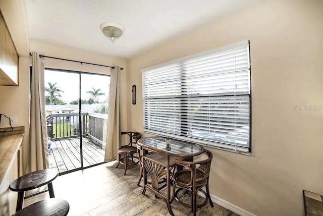 725 1st St, Indian Rocks Beach, FL 33785 - dining space featuring wood finished floors and baseboards