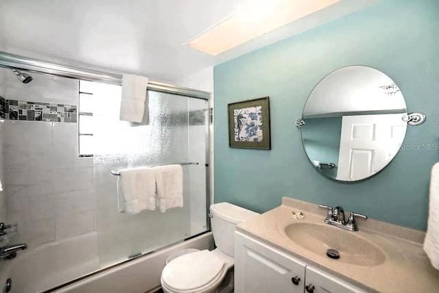725 1st St, Indian Rocks Beach, FL 33785 - full bath with combined bath / shower with glass door, vanity, and toilet