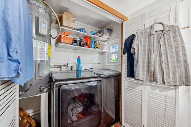 laundry area with washing machine and clothes dryer