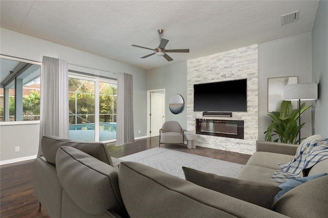 10537 Greensprings Dr, Tampa, FL 33626 - living room featuring baseboards, a ceiling fan, wood finished floors, and a textured ceiling