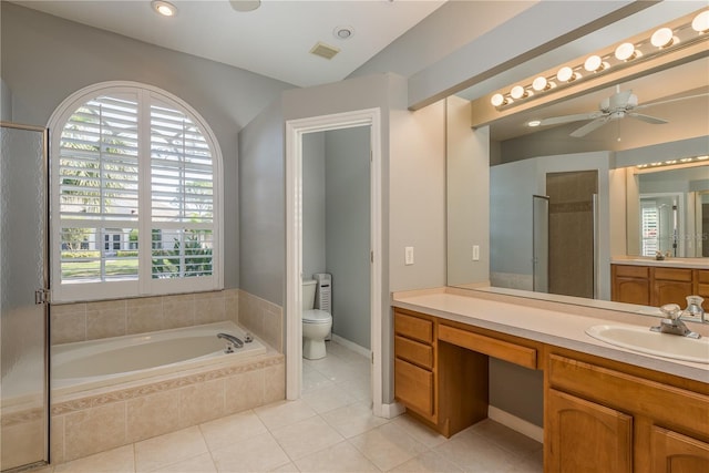 10537 Greensprings Dr, Tampa, FL 33626 - full bath with a bath, toilet, vanity, tile patterned floors, and a ceiling fan