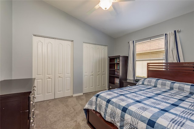 10537 Greensprings Dr, Tampa, FL 33626 - carpeted bedroom featuring lofted ceiling, two closets, ceiling fan, and baseboards