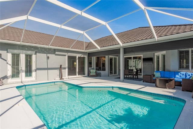 10537 Greensprings Dr, Tampa, FL 33626 - outdoor pool featuring an outdoor hangout area, a patio area, french doors, and a lanai