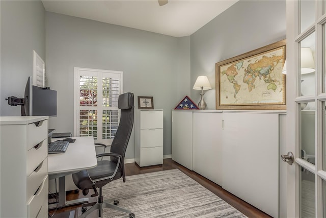 10537 Greensprings Dr, Tampa, FL 33626 - office area featuring dark wood-style flooring and baseboards