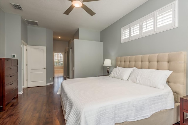 10537 Greensprings Dr, Tampa, FL 33626 - bedroom with dark wood finished floors, ensuite bathroom, a ceiling fan, and baseboards