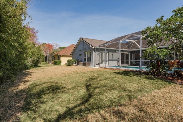 10537 Greensprings Dr, Tampa, FL 33626 - view of grassy yard featuring a lanai and an outdoor pool