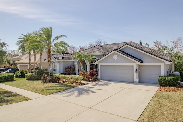 10537 Greensprings Dr, Tampa, FL 33626 - view of front of house featuring concrete driveway, an attached garage, stucco siding, a front lawn, and a tiled roof
