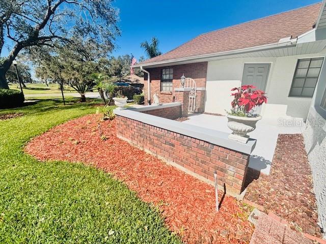 exterior space with a lawn and a patio area