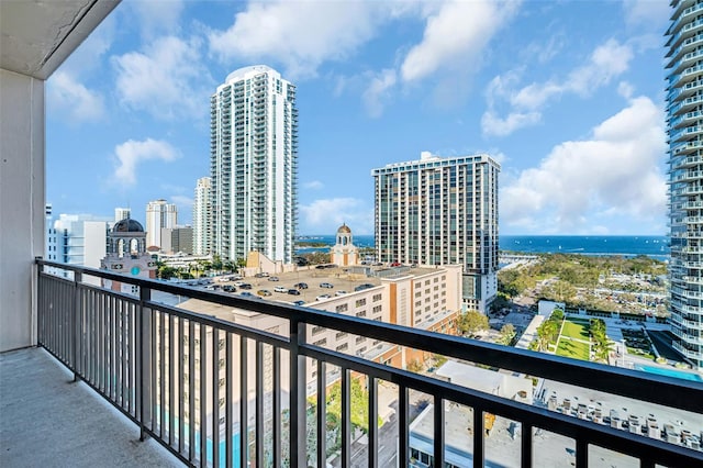 balcony featuring a water view and a view of city