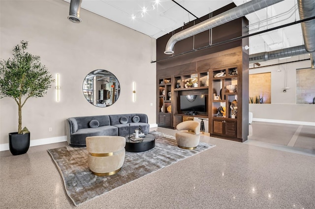 living room featuring a towering ceiling