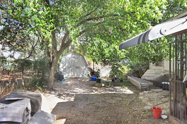 view of yard with a storage shed