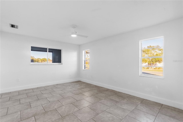 unfurnished room with ceiling fan