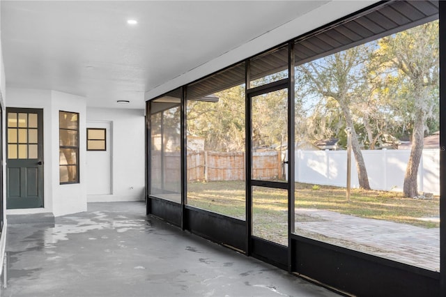 unfurnished sunroom featuring a healthy amount of sunlight