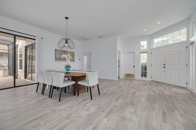 dining area with light hardwood / wood-style floors