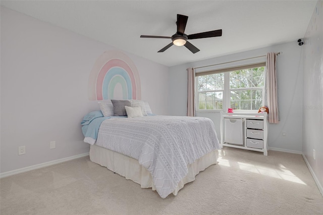 bedroom with ceiling fan and light colored carpet