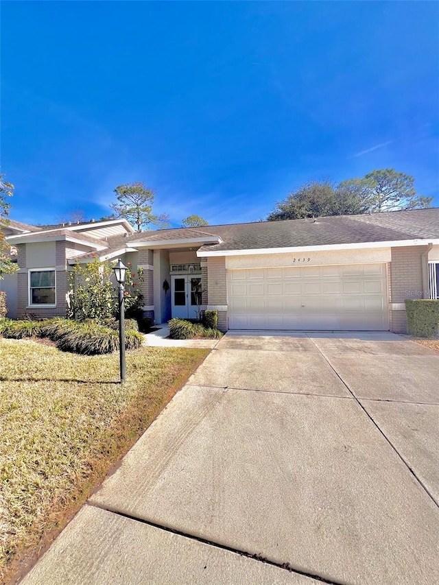 ranch-style house featuring a garage