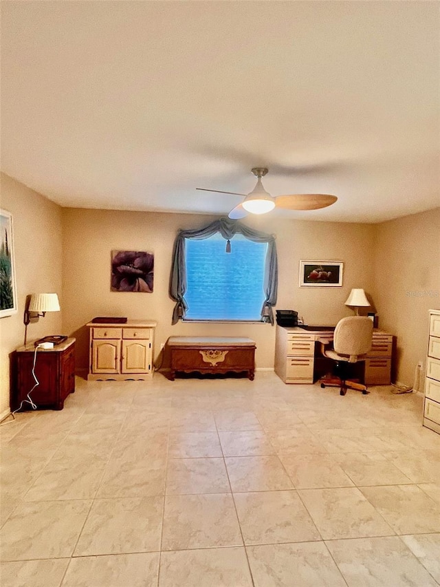 interior space featuring light tile patterned floors and ceiling fan